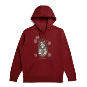 Model wearing burgundy Roye Life hoodie featuring the adorned Fortuna logo — symbolic of good luck, resilience, and alignment in motion.